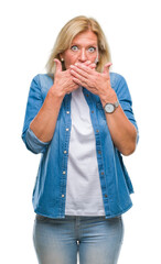 Sticker - Middle age blonde woman over isolated background shocked covering mouth with hands for mistake. Secret concept.