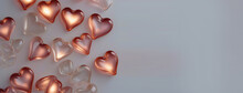 Lots Of Little Glass Hearts On A Gray Background