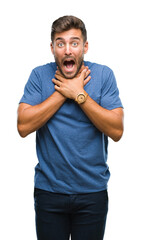 Canvas Print - Young handsome man over isolated background shouting and suffocate because painful strangle. Health problem. Asphyxiate and suicide concept.