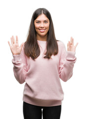 Poster - Young beautiful hispanic woman wearing a sweater showing and pointing up with fingers number eight while smiling confident and happy.