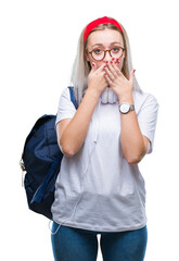 Sticker - Young blonde student woman wearing glasses and backpack over isolated background shocked covering mouth with hands for mistake. Secret concept.