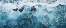 Drone Footage Picture Of Oceanic Blue Waves Bumping Into The Rocks