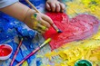 © talkative.studio - Creative kid painting heart with bright colors and brush