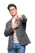 © Krakenimages.com - Young business man wearing glasses over isolated background Laughing of you, pointing to the camera with finger hand over mouth, shame expression