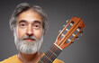 © luengo_ua - Aged bearded man with an acoustic guitar