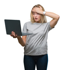 Sticker - Young caucasian woman using computer laptop over isolated background stressed with hand on head, shocked with shame and surprise face, angry and frustrated. Fear and upset for mistake.