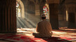 Muslim elder sitting in masjid reading quran before prayer time at subdued dark light