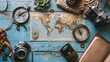 Flat lay of a travel enthusiasts desk with a world map a vintage compass travel guides and a camera evoking a sense of adventure.