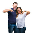 © Krakenimages.com - Middle age hispanic casual couple over isolated background looking confident with smile on face, pointing oneself with fingers proud and happy.