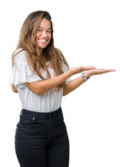 Canvas Print - Young beautiful brunette business woman over isolated background Pointing to the side with hand and open palm, presenting ad smiling happy and confident