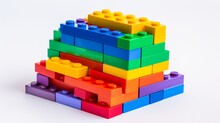 A Pile Of Rainbow Building Bricks On A White Background.