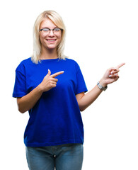 Sticker - Young beautiful blonde woman wearing glasses over isolated background smiling and looking at the camera pointing with two hands and fingers to the side.