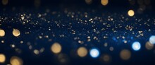 Gold Glitter Particle On Blue Background Banner With Bokeh Lights. Abstract Blue And Gold Backdrop.