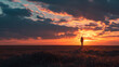 © MYKHAILO KUSHEI - the silhouette of a person standing on an endless plain pose and admiring an incredibly beautiful sunset