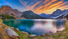 HDR Landscape Of A Lake In The Mountains At Sunset