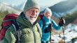 © Maciej Koba - Senior Couple with Backpacks Hiking in Snowy Mountains