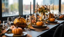 Elegantly Set Table With Small Pumpkins Candles, Smudged Background. Pumpkin As A Dish Of Thanksgiving For The Harvest.