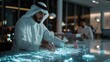 © Oulaphone - Arabian businessman touching hologram display while checking digital information new project in office.