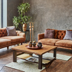 Wooden coffee table and two velvet sofas. Interior design of modern living room