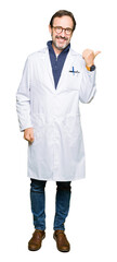 Poster - Middle age therapist wearing white coat smiling with happy face looking and pointing to the side with thumb up.