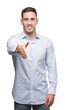 © Krakenimages.com - Handsome young businessman smiling friendly offering handshake as greeting and welcoming. Successful business.