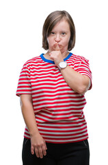 Sticker - Young adult woman with down syndrome over isolated background asking to be quiet with finger on lips. Silence and secret concept.