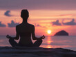 © koala studio - Woman practicing yoga on the beach at sunset. The concept of healthy lifestyle and relaxation.