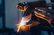 A craftsman welding a metal rose