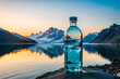 bottle of fresh mineral water in front of a mountain lake, epic sunlight