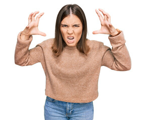 Sticker - Young beautiful woman wearing casual clothes shouting frustrated with rage, hands trying to strangle, yelling mad