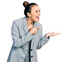 Poster - Young hispanic girl pointing open palm with finger angry and mad screaming frustrated and furious, shouting with anger. rage and aggressive concept.