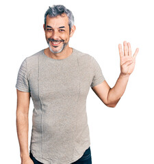 Sticker - Middle age hispanic with grey hair wearing casual grey t shirt showing and pointing up with fingers number four while smiling confident and happy.