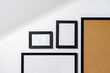 © fotofabrika - Set of black frames on white wall with copy space