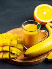Wall Mural - yellow exotic smoothie with mango, orange and banana.