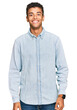 © Krakenimages.com - Young handsome african american man wearing casual clothes with a happy and cool smile on face. lucky person.