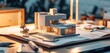 © olegganko - a set of house plans on a table with a model on the table