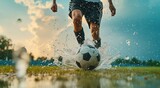 Fototapeta Sport - athlete playing soccer with water on a ball