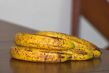 Ripe Banana bunch with Dark Spots on Table 5