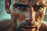 Fototapeta Sport - Close-up of a Focused Male Athlete with Intense Eyes and Sweat on Face