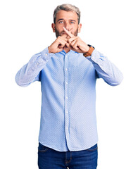 Canvas Print - Young handsome blond man wearing elegant shirt rejection expression crossing fingers doing negative sign