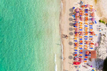 Wall Mural - aerial view on beach, people and umbrellas. vacation and adventure. europe, mediterranean sea. top v