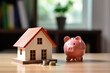 House and pig piggy bank with coins. Real estate and savings. Saving money to maintain property. Municipal budget for the maintenance of buildings. Price cost estimate. Payment of taxes and utilities