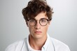 © Alina - Portrait of young man in eyeglasses on white background