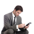 © ayselucar - a businessman in a suit reading messages on the phone on isolated transparent background