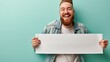 Handsome white american man holding blank placard for text and ads on pastel blue background