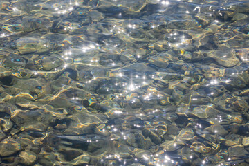 top view of the sea rocky shore in the bright sun. rays and glare on the water. excellent reference 
