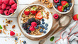 Delicious bowl of yogurt topped with fresh berries and crunchy nuts. Perfect for healthy breakfast or snack.