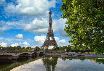 Paris Eiffel Tower and river Seine at sunset in Paris, France. Eiffel Tower is one of the most iconic landmarks of Paris