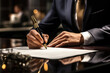 Man in suit signing important document. Suitable for business and legal concepts.