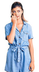 Poster - Young beautiful woman wearing casual clothes looking stressed and nervous with hands on mouth biting nails. anxiety problem.